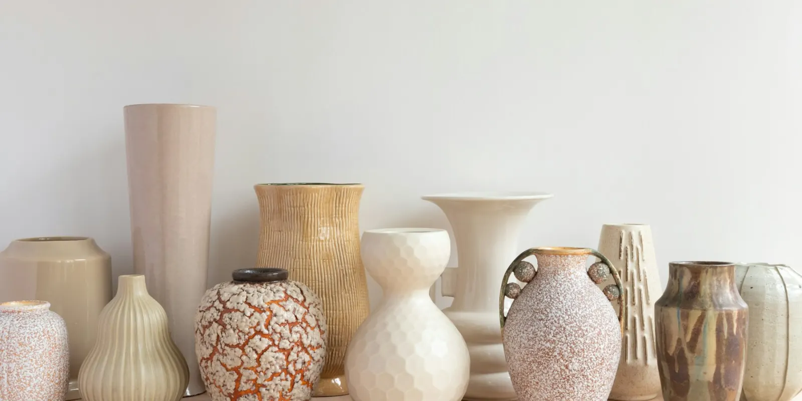 A shelf of handmade ceramic vases